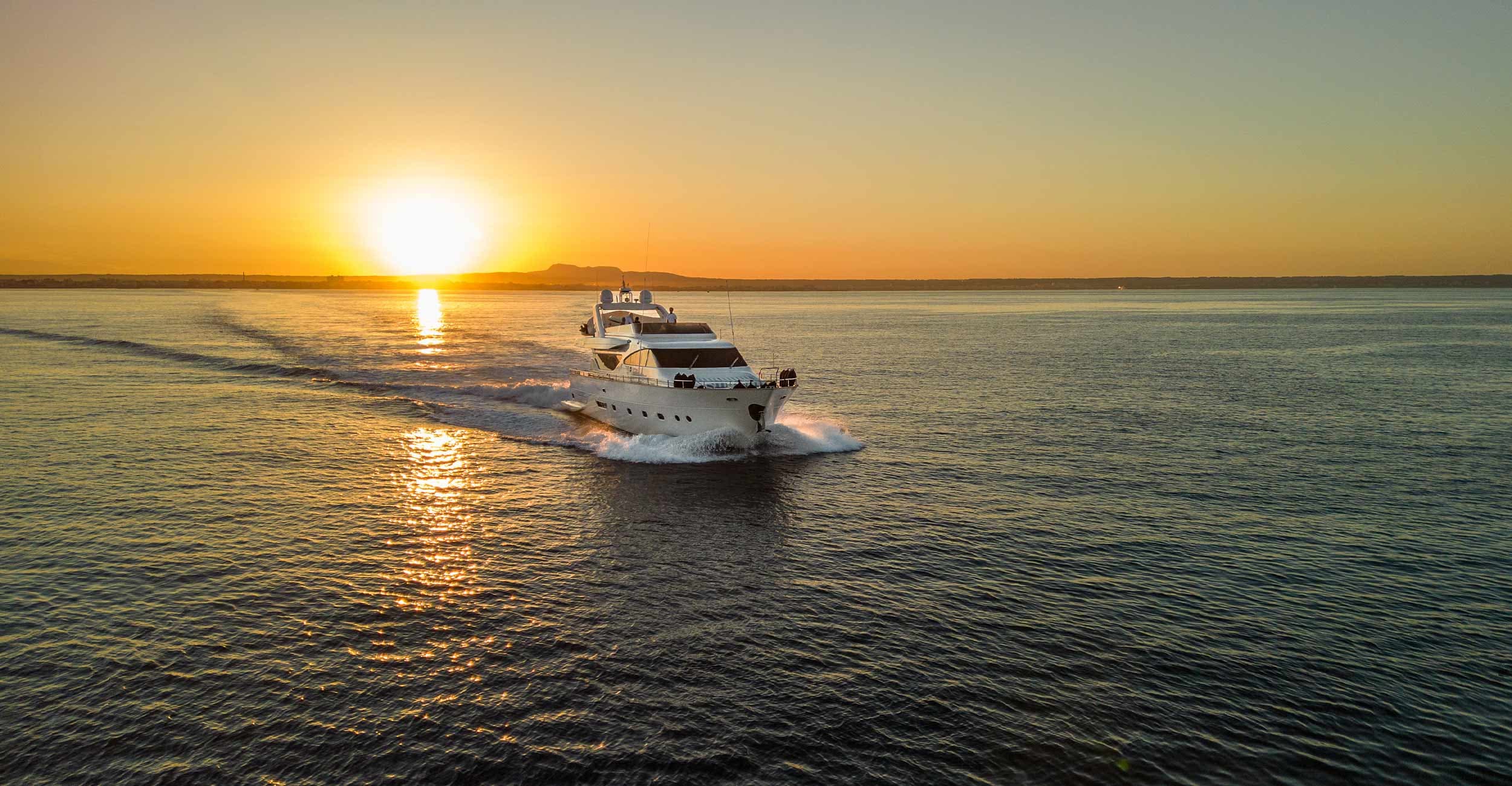 ESSOESS, a 24-metre Alalunga 78 yacht, cruising at sunset off Palma de Mallorca
